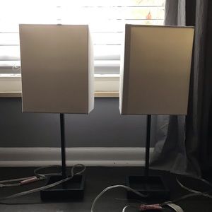 Target lamps. Grey base with square white shade.